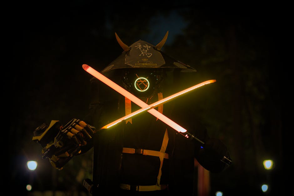 Réplica de sable de luz brillante sobre fondo oscuro, coleccionismo oficial Star Wars